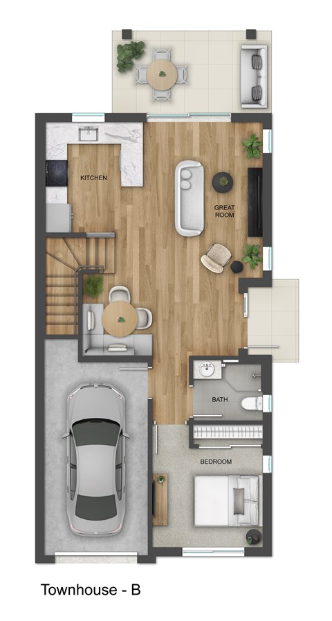 A floor plan of a townhouse with a kitchen, great room, and bedroom.